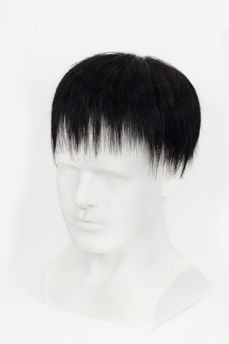 Black hair toupee on a mannequin head against a white background