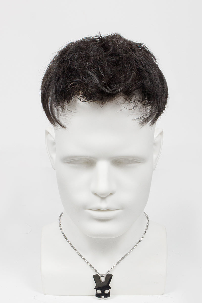 Mannequin head with a black wig on a white background