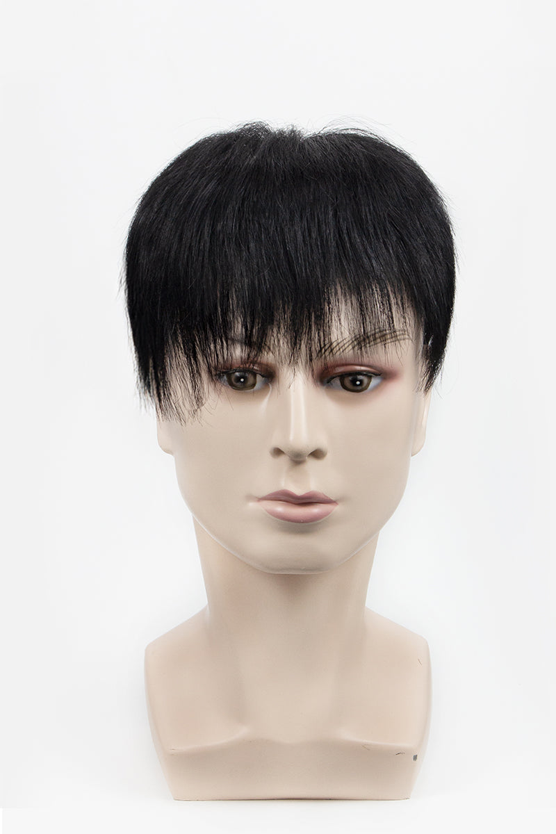 Black toupee on a mannequin head against a white background