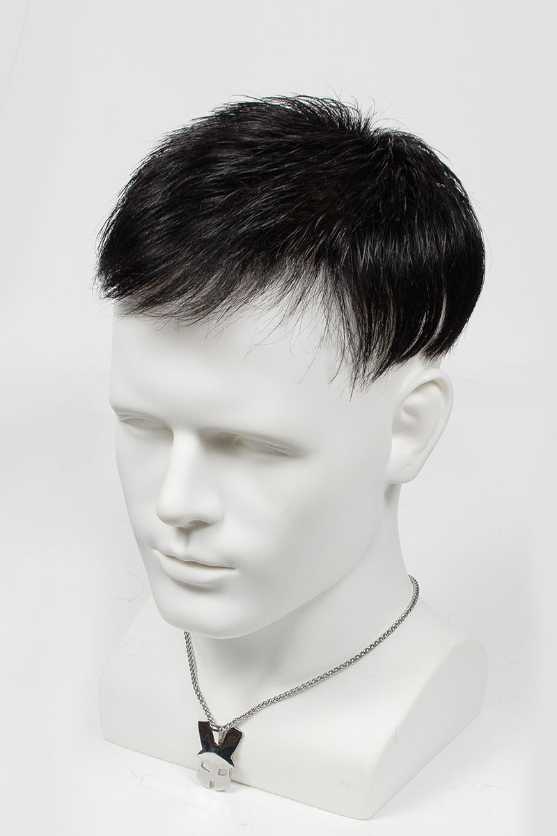 Mannequin head with a black hairpiece on a white background