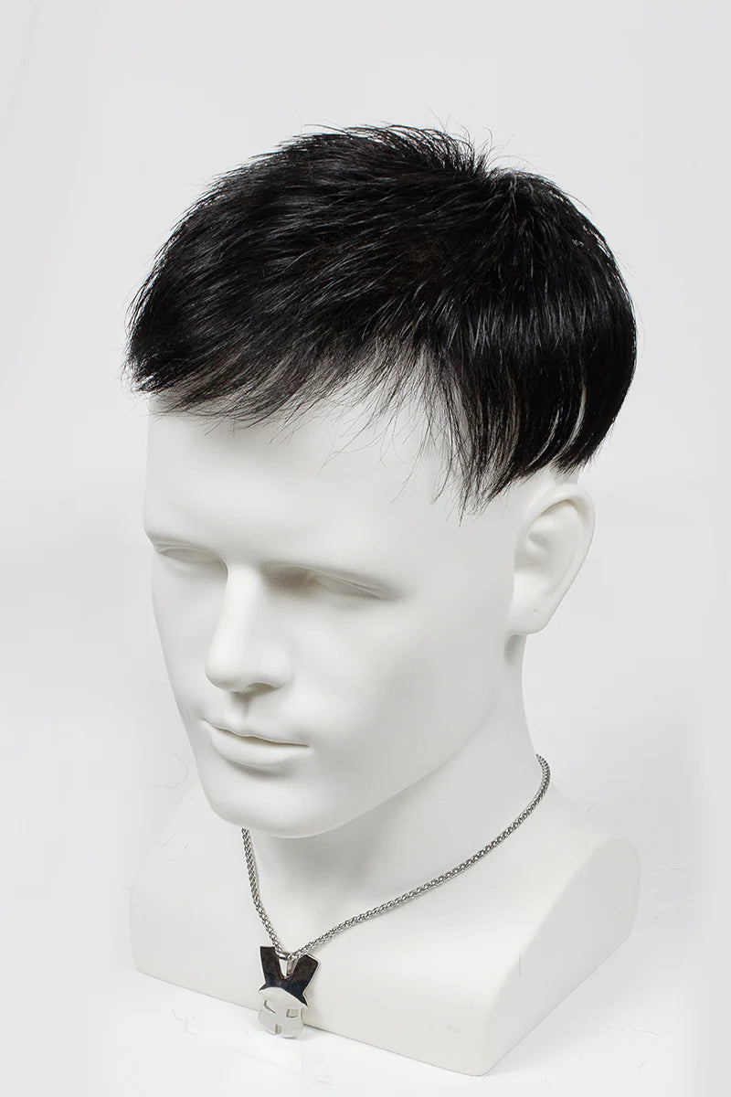 Mannequin head with a black wig on a white background