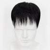 Black hair toupee on a mannequin head against a white background
