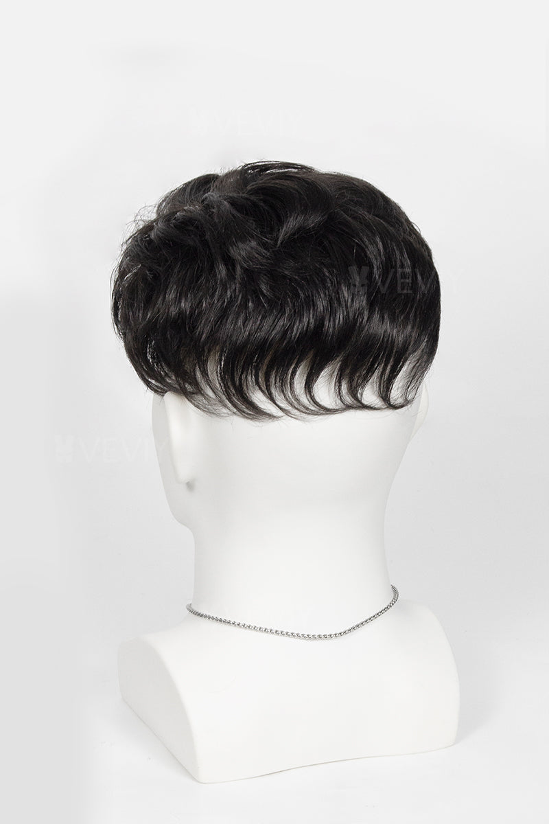 Corey topper on a mannequin head against a white background