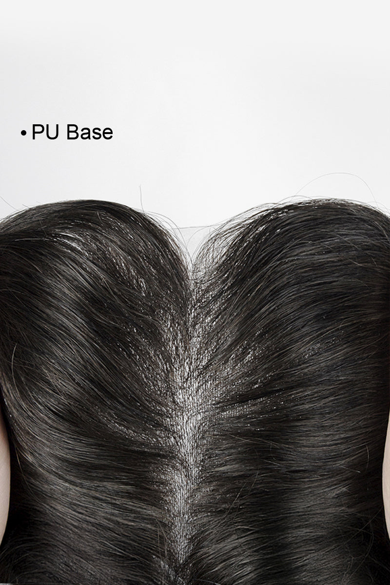 Close-up of a person's head with black hair, showing the PU base.