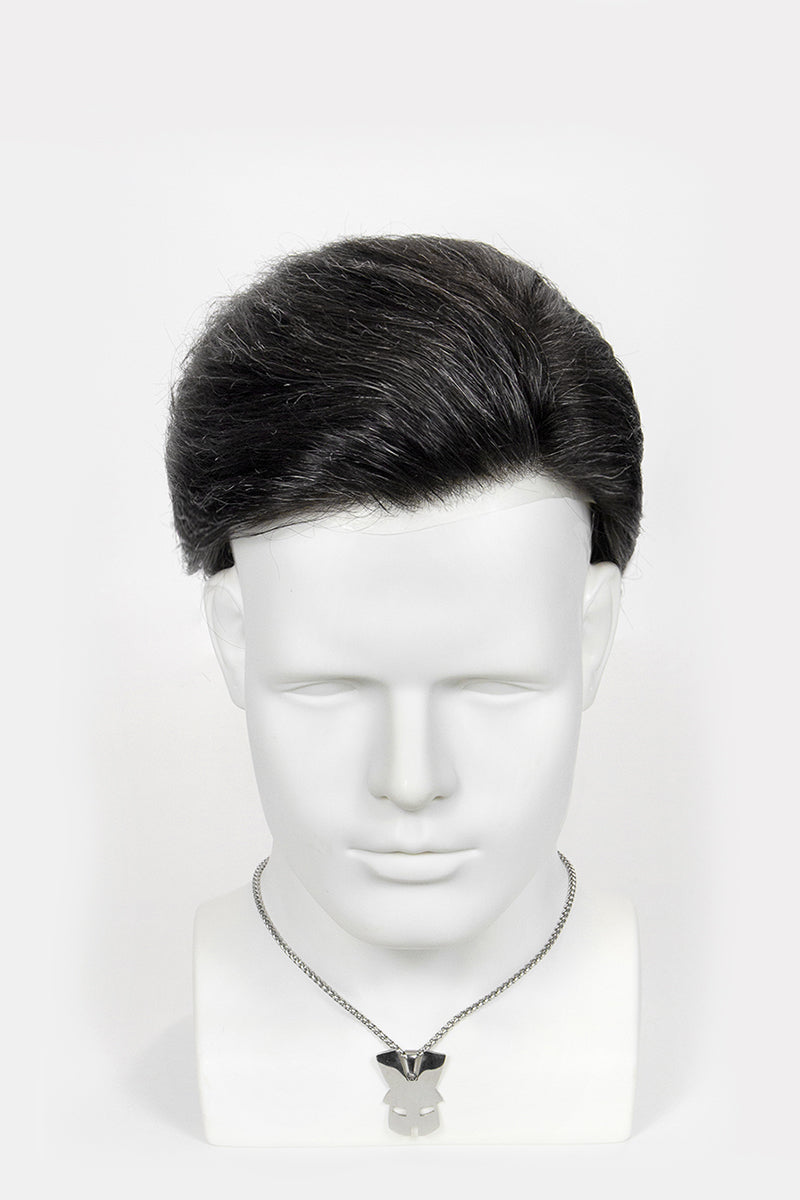 Black wig on a mannequin head against a white background
