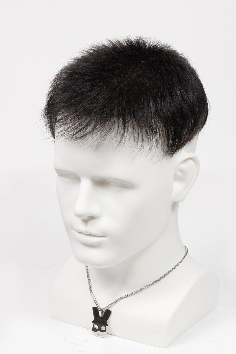 Mannequin head with a black wig on a white background