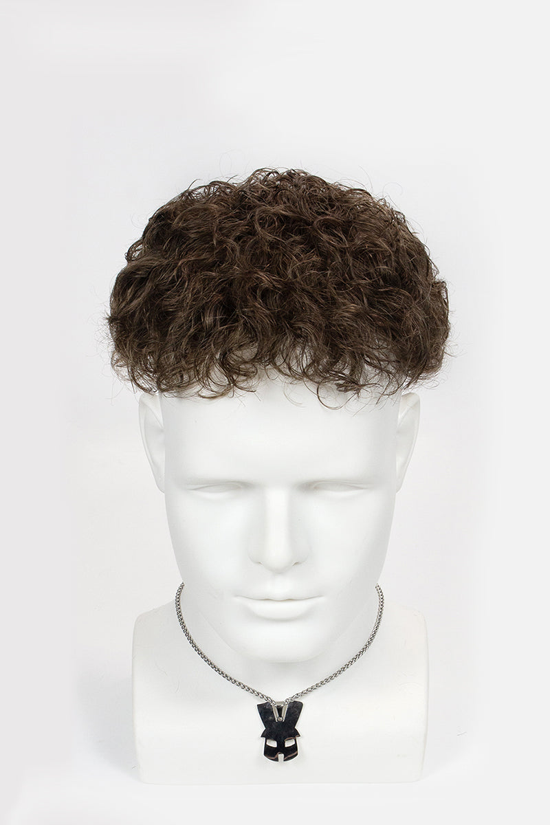 Mannequin head with a brown curly wig on a white background