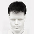 Mannequin head with a black and white necklace on a white background