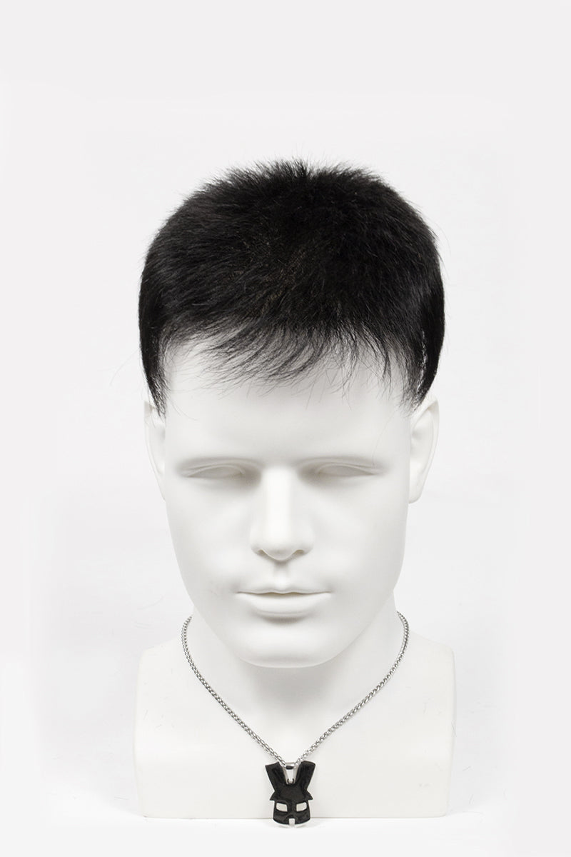 Mannequin head with a black and white necklace on a white background