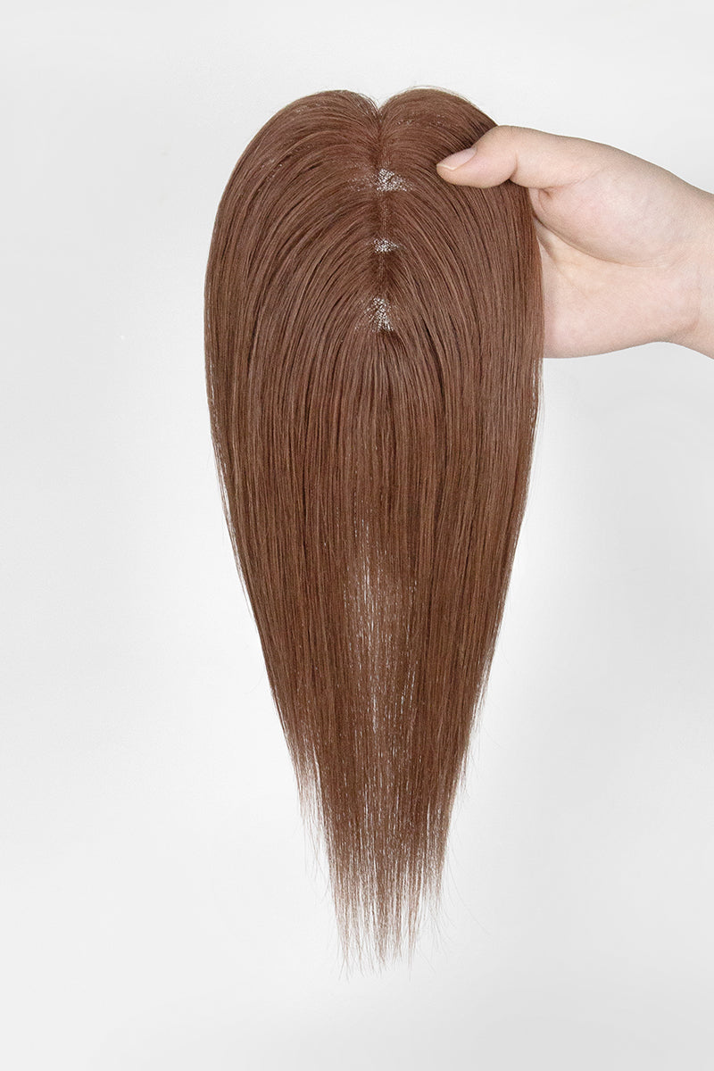 Mona Human Hair Topper Dark Auburn Brown #33 held by a hand on a white background